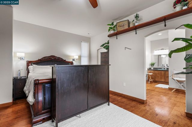 a kitchen with stainless steel appliances kitchen island granite countertop a refrigerator and a sink
