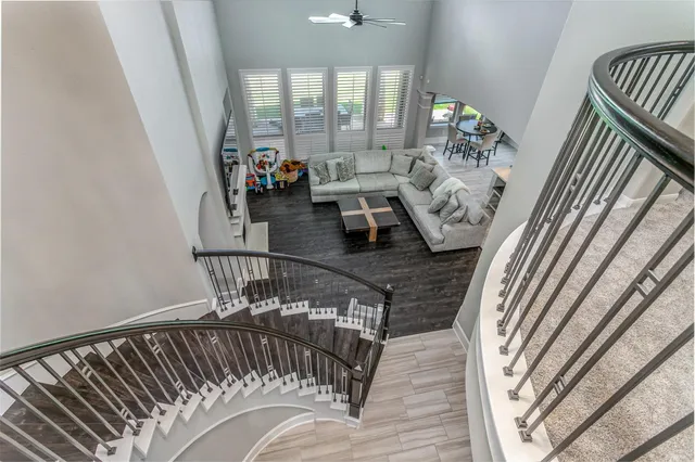 a bathroom with a granite countertop toilet a sink and a mirror