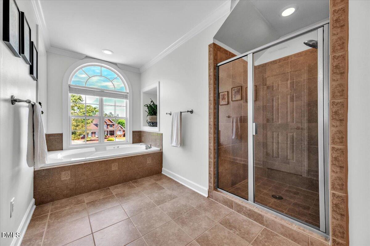 2908 Oak Bridge Drive Raleigh, NC 27610 - Photo 24 of 47 a large white kitchen with a large window and front door