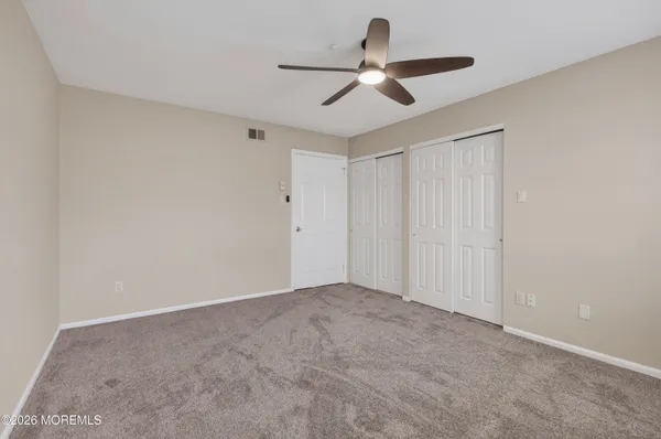 a view of a ceiling fan in a room