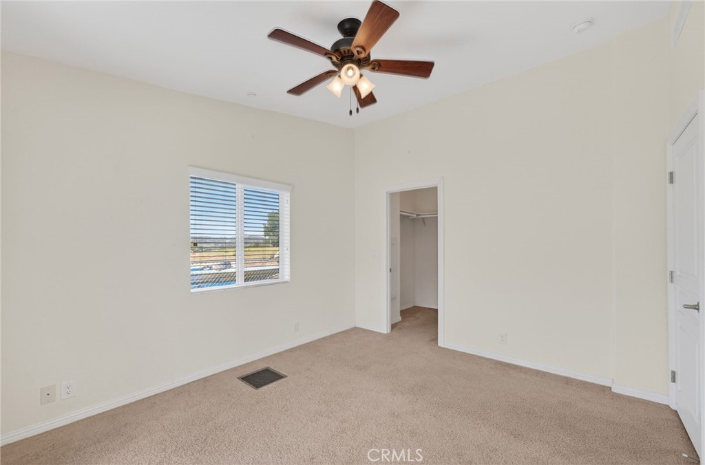 39230 Grassy Road Temecula, CA 92592 - Photo 18 of 33 a view of a livingroom with a ceiling fan and window