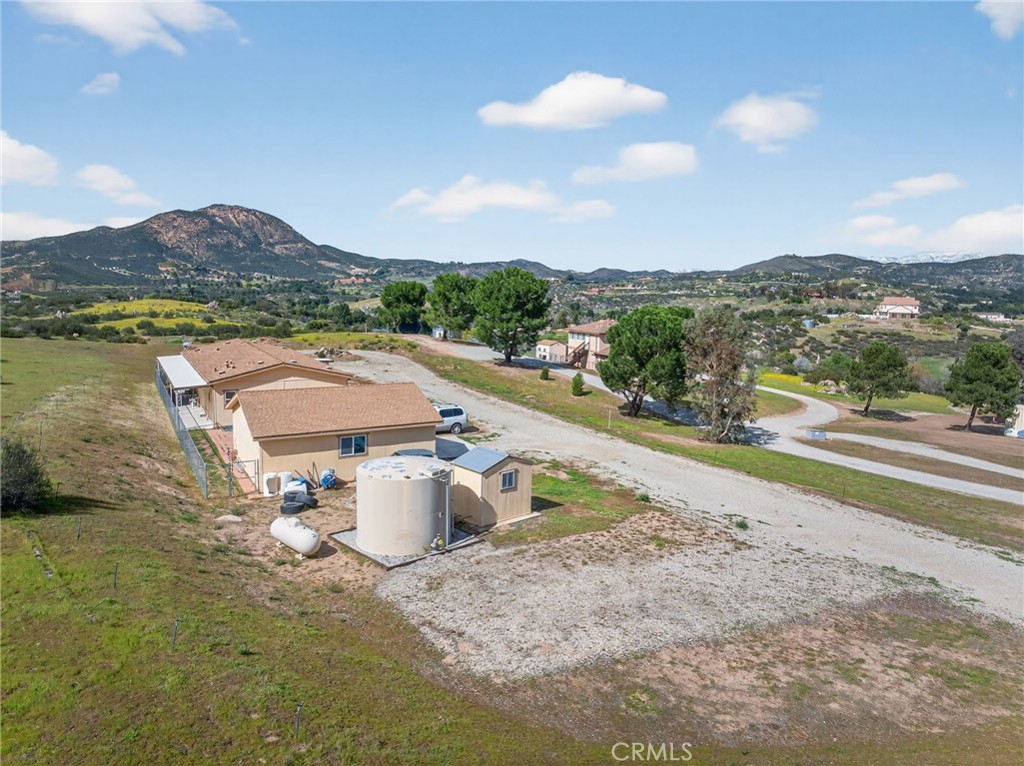 39230 Grassy Road Temecula, CA 92592 - Photo 33 of 33 a view of a terrace with a table and chairs