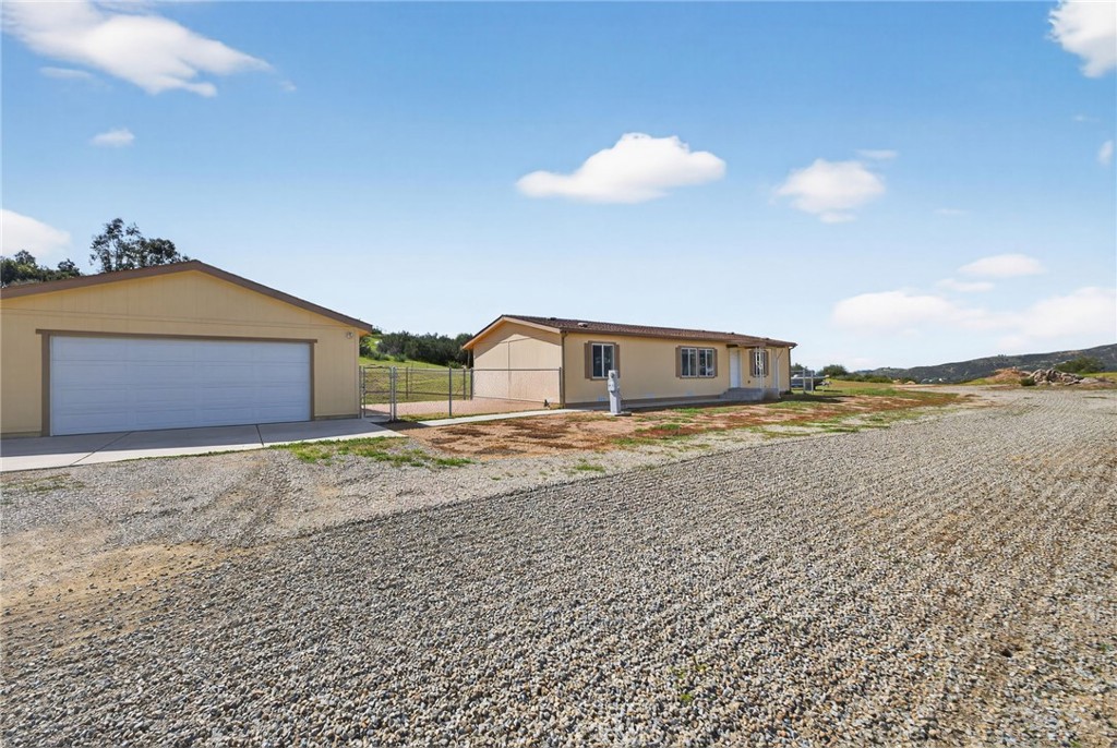 39230 Grassy Road Temecula, CA 92592 - Photo 5 of 33 a house view with a lake