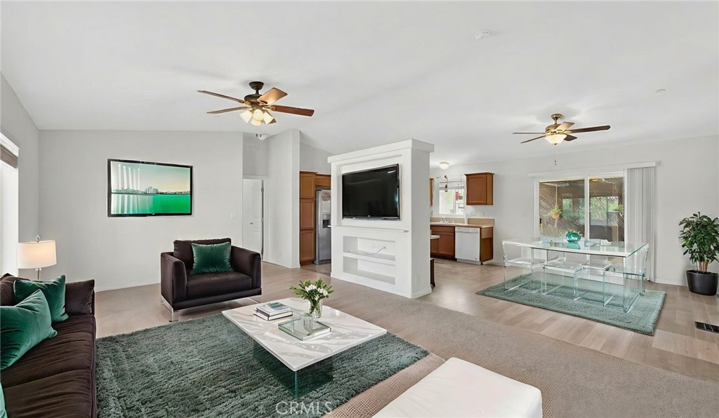 39230 Grassy Road Temecula, CA 92592 - Photo 8 of 33 a living room with furniture a flat screen tv and a table