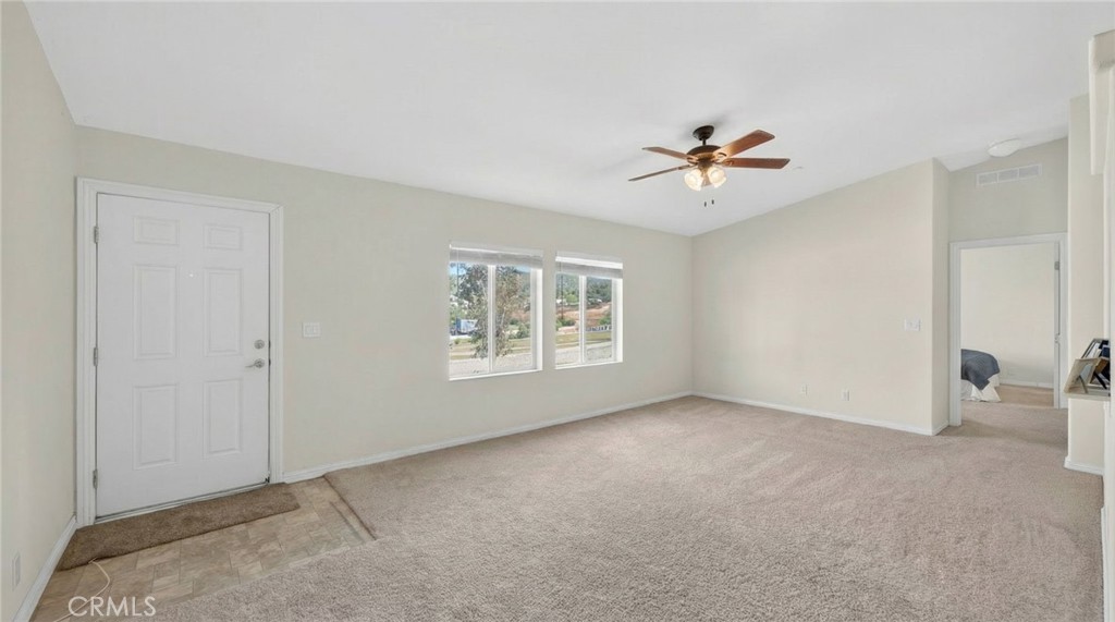 39230 Grassy Road Temecula, CA 92592 - Photo 9 of 33 a view of an empty room with a window