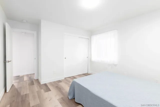 a room with a bed and window