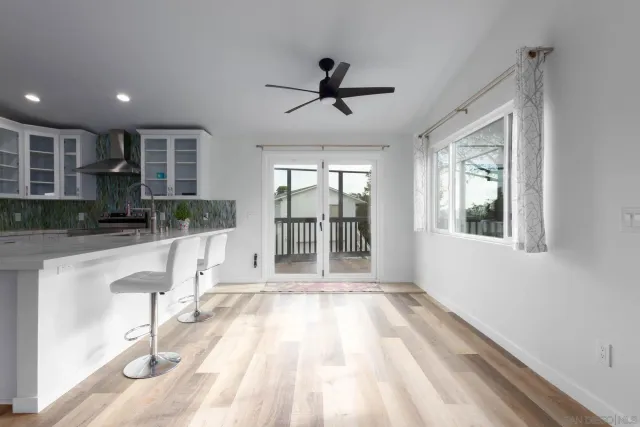 a bathroom with a sink a toilet a shower and a mirror