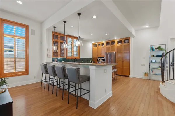 a view of a dining room with furniture and wooden floor