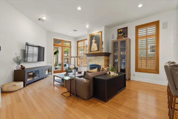 a living room with fireplace furniture and a flat screen tv