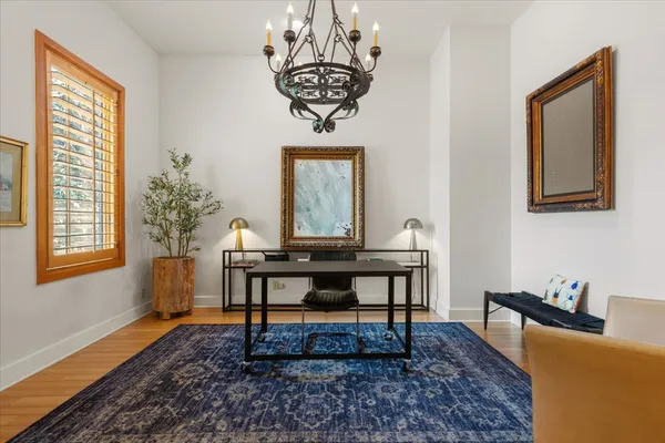 a view of a livingroom with furniture window and wooden floor