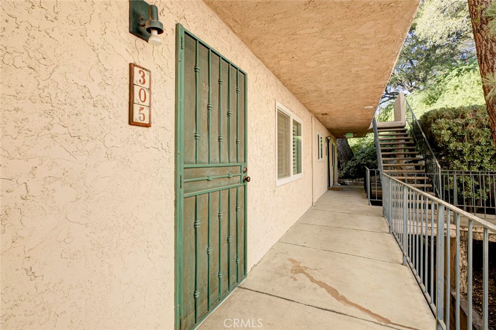 2940 North Verdugo Road, Unit 305 Glendale, CA 91208 - Photo 2 of 26 a view of a porch with wooden floor and stairs