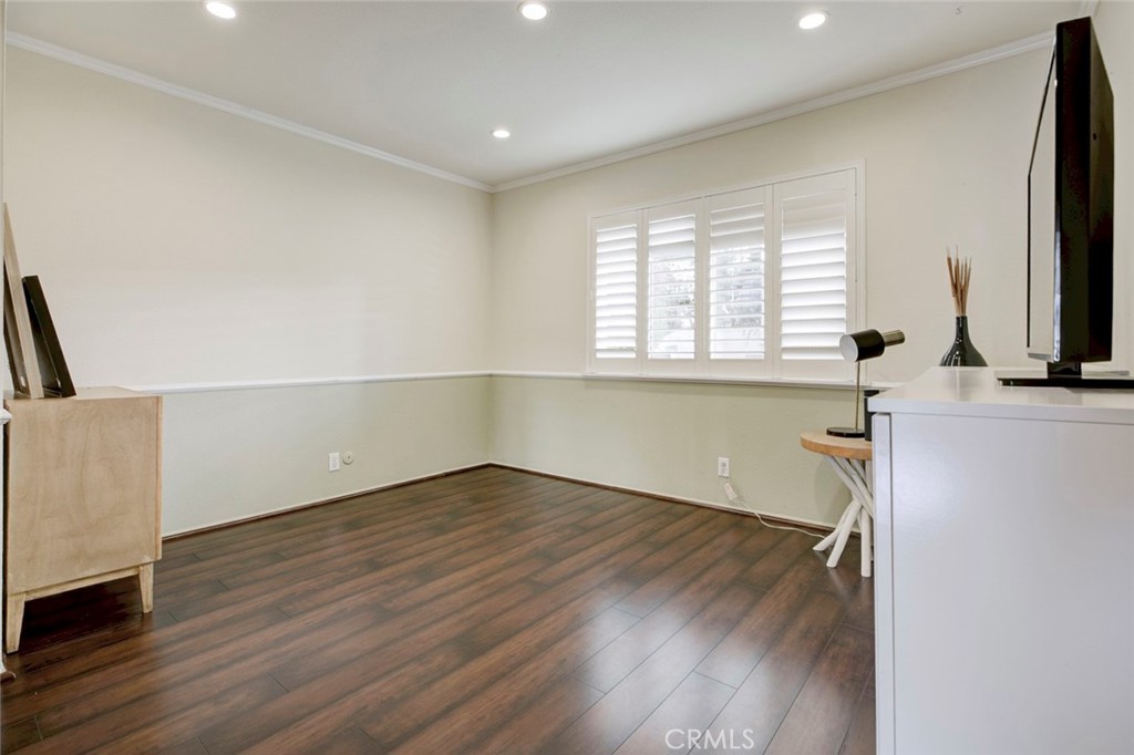 2940 North Verdugo Road, Unit 305 Glendale, CA 91208 - Photo 22 of 26 an empty room with wooden floor and windows