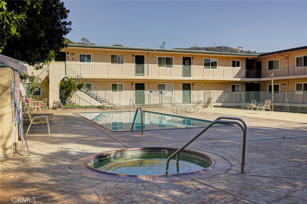 2940 North Verdugo Road, Unit 305 Glendale, CA 91208 - Photo 26 of 26 a backyard of a house with barbeque oven table and chairs