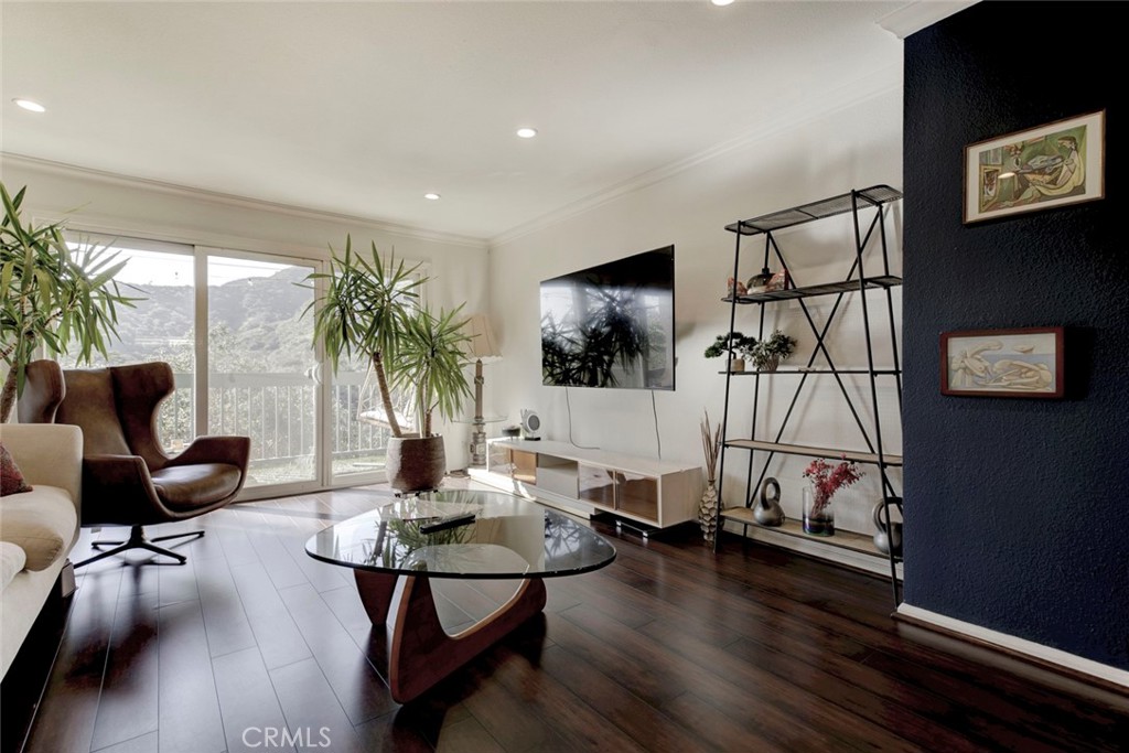 2940 North Verdugo Road, Unit 305 Glendale, CA 91208 - Photo 4 of 26 a living room with furniture and a flat screen tv