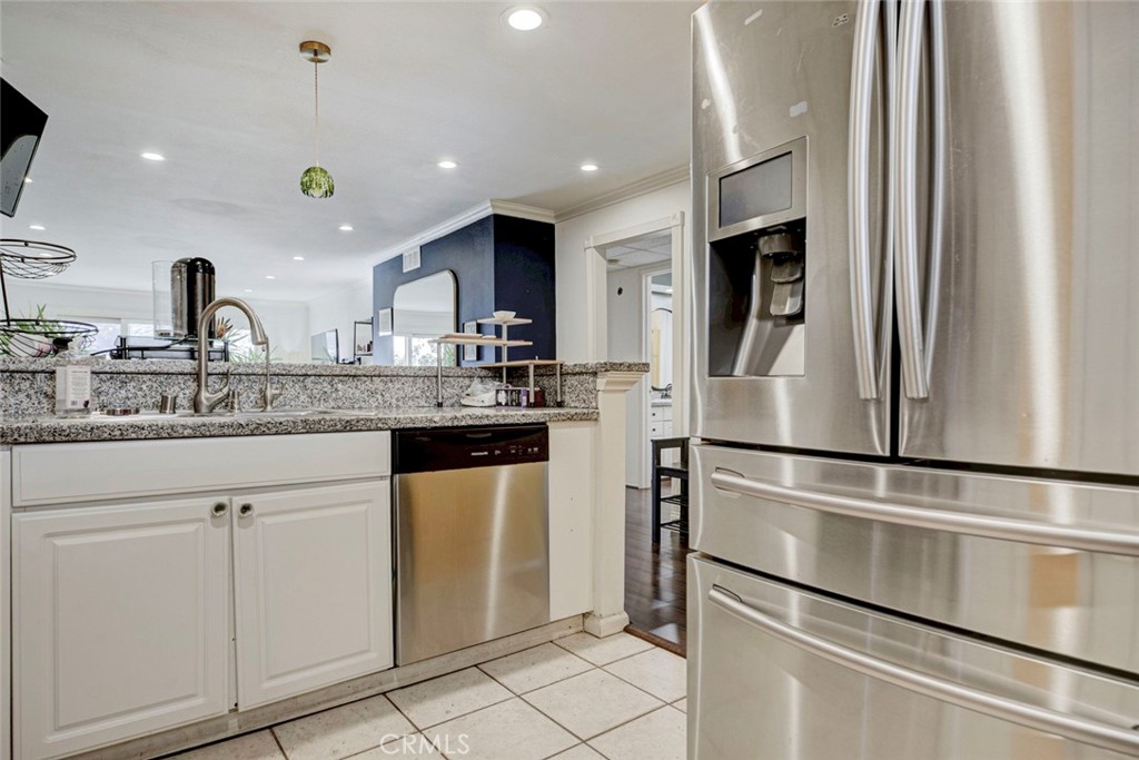 2940 North Verdugo Road, Unit 305 Glendale, CA 91208 - Photo 9 of 26 a kitchen with stainless steel appliances granite countertop a refrigerator and a sink