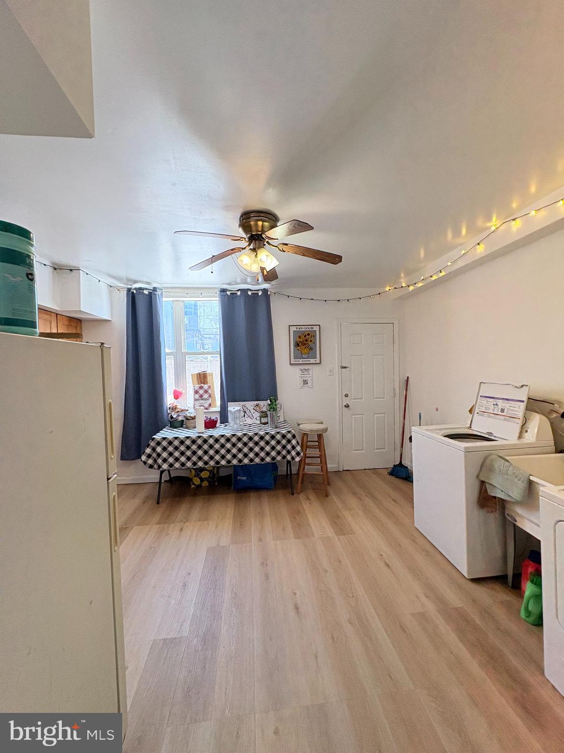 2033 South 9th Street Philadelphia, PA 19148 - Photo 4 of 15 a view of a room with wooden floor and staircase