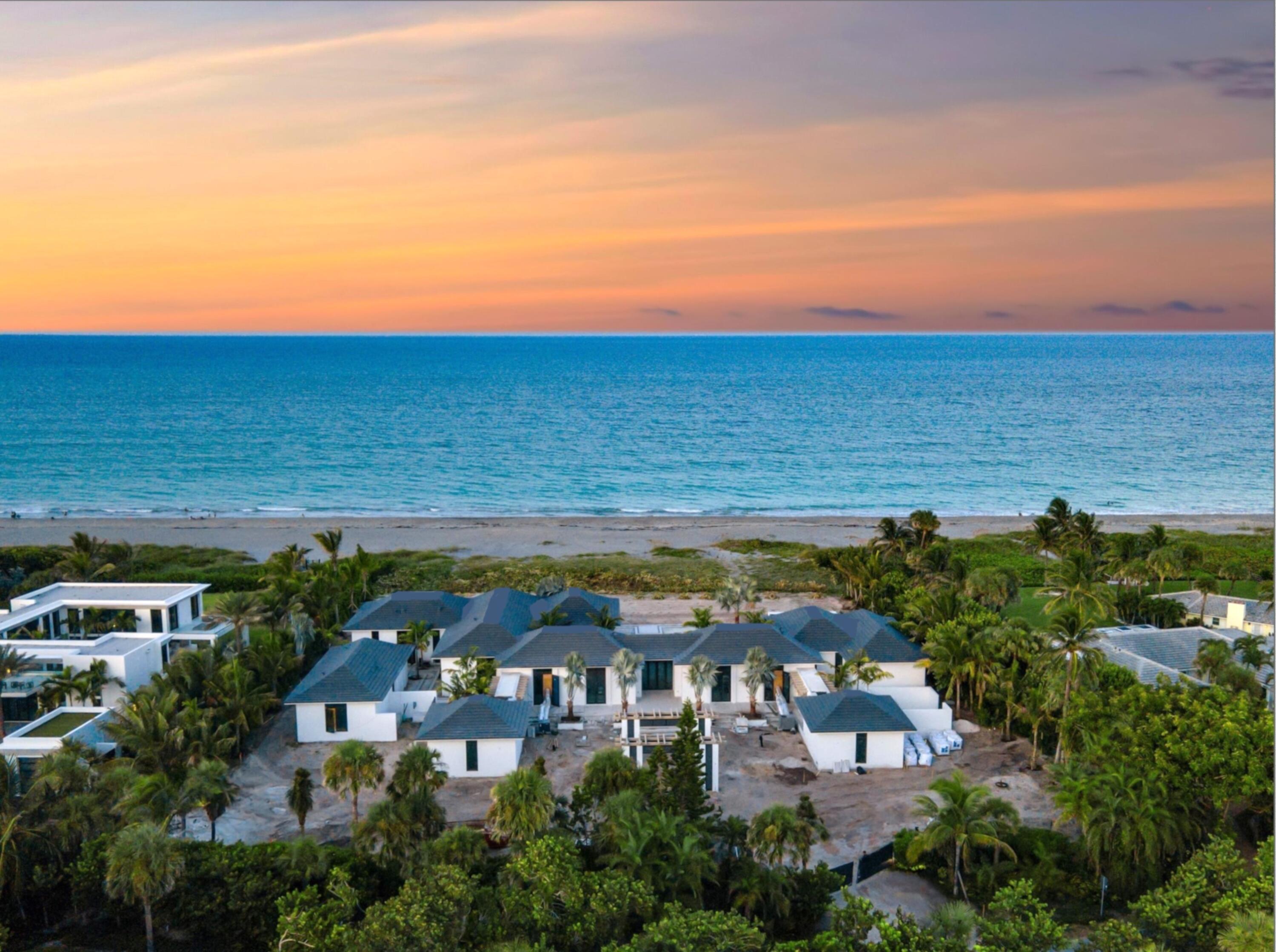an aerial view of residential building and ocean