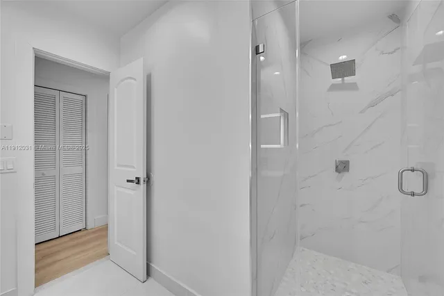 a bathroom with a toilet sink and a shower