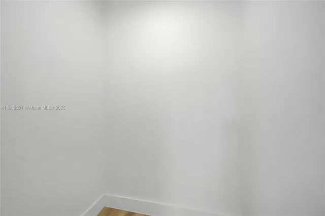 a kitchen with a refrigerator and a sink