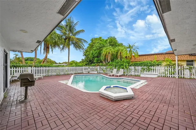 an aerial view of residential houses with outdoor space and street view