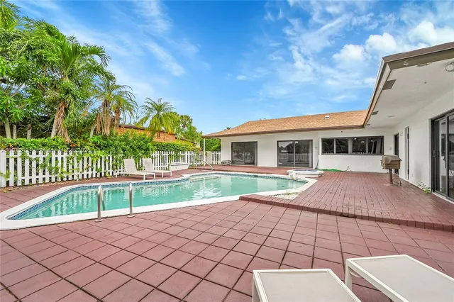 a view of a garden with a building in the background