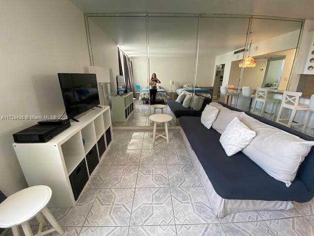 100 Lincoln Road, Unit 616 Miami Beach, FL 33139 - Photo 14 of 31 a living room with furniture and a flat screen tv