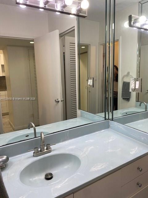 100 Lincoln Road, Unit 616 Miami Beach, FL 33139 - Photo 17 of 31 a bathroom with a sink and a mirror