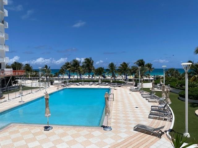 100 Lincoln Road, Unit 616 Miami Beach, FL 33139 - Photo 26 of 31 a view of a swimming pool with outdoor seating