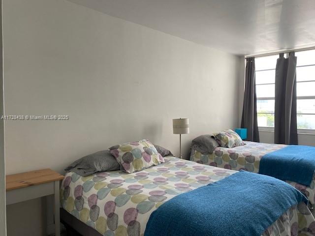 100 Lincoln Road, Unit 616 Miami Beach, FL 33139 - Photo 4 of 31 a bedroom with two beds and a window
