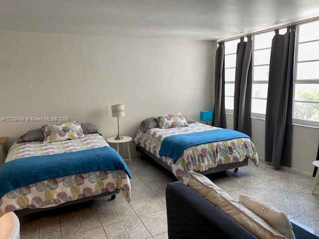 100 Lincoln Road, Unit 616 Miami Beach, FL 33139 - Photo 5 of 31 a bedroom with a bed and a window