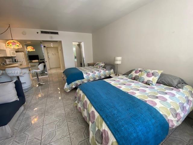 100 Lincoln Road, Unit 616 Miami Beach, FL 33139 - Photo 6 of 31 a bedroom with double bed and a window