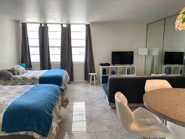 100 Lincoln Road, Unit 616 Miami Beach, FL 33139 - Photo 7 of 31 a living room with furniture and a flat screen tv