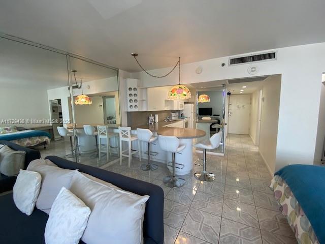 100 Lincoln Road, Unit 616 Miami Beach, FL 33139 - Photo 8 of 31 a living room with lots of furniture and white walls