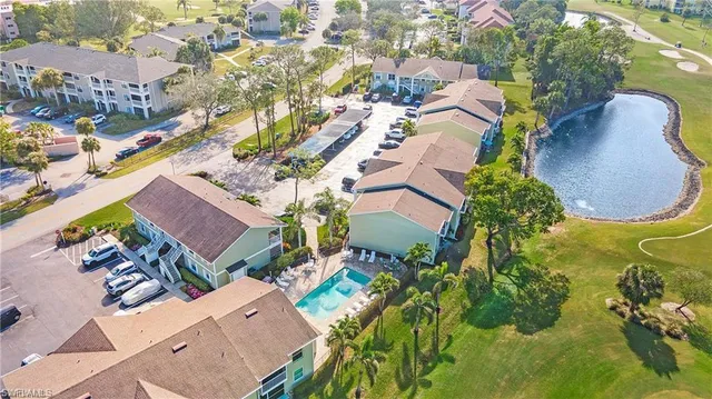 an aerial view of residential house with outdoor space and swimming pool