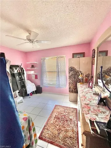 a bed room with furniture and a window