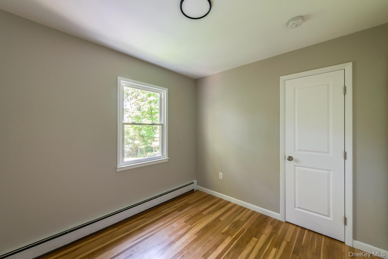 676-678 Oak Summit Road Millbrook, NY 12545 - Photo 21 of 38 Second bedroom, nice hardwood floors