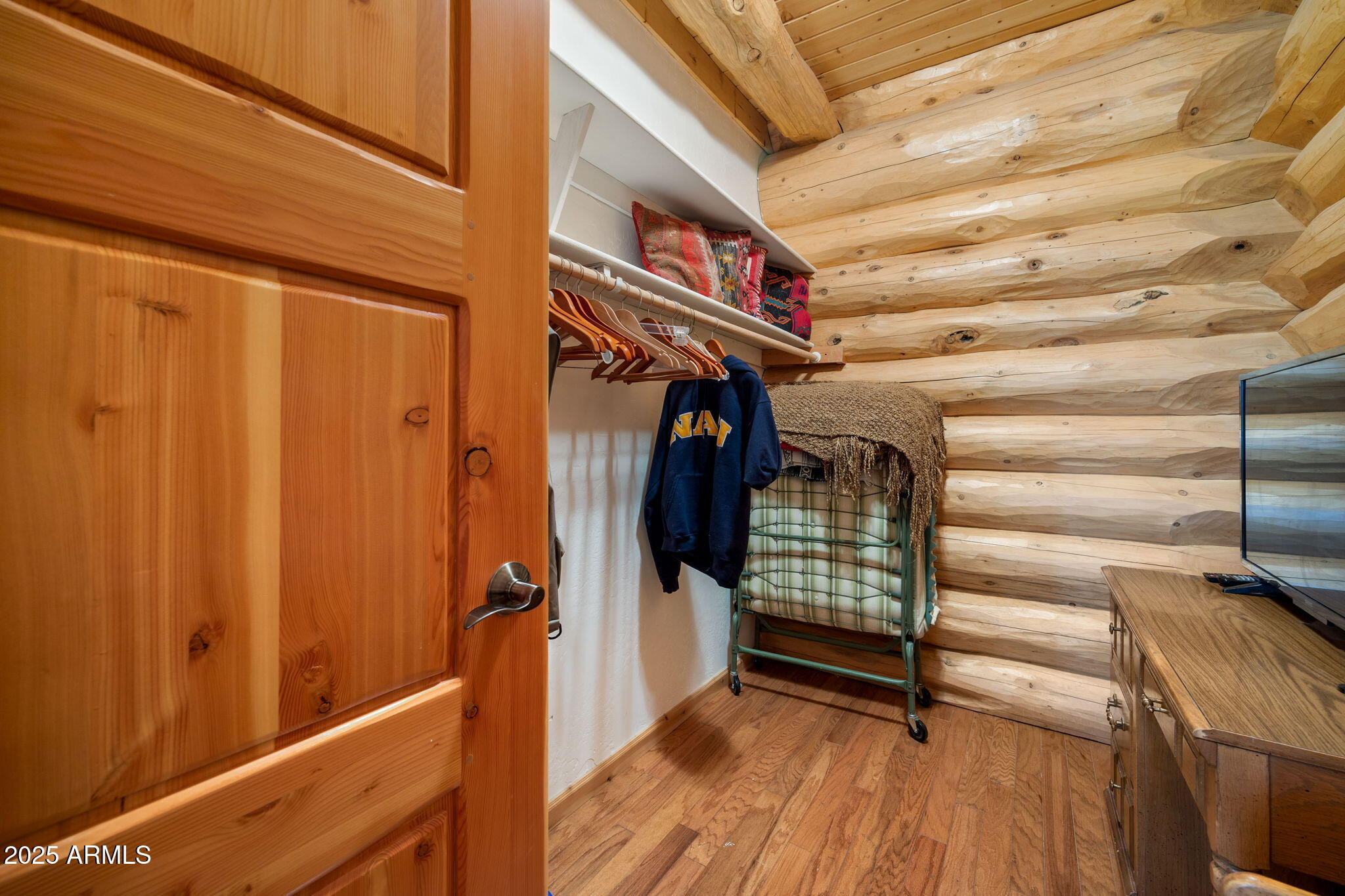 30 N1068 Greer, AZ 85927 - Photo 22 of 50 a view of walk in closet with clothes and shoes