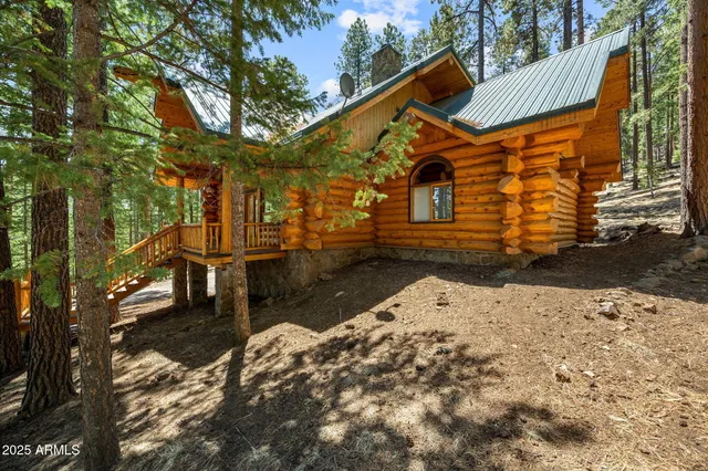 a yellow house with trees in front of it