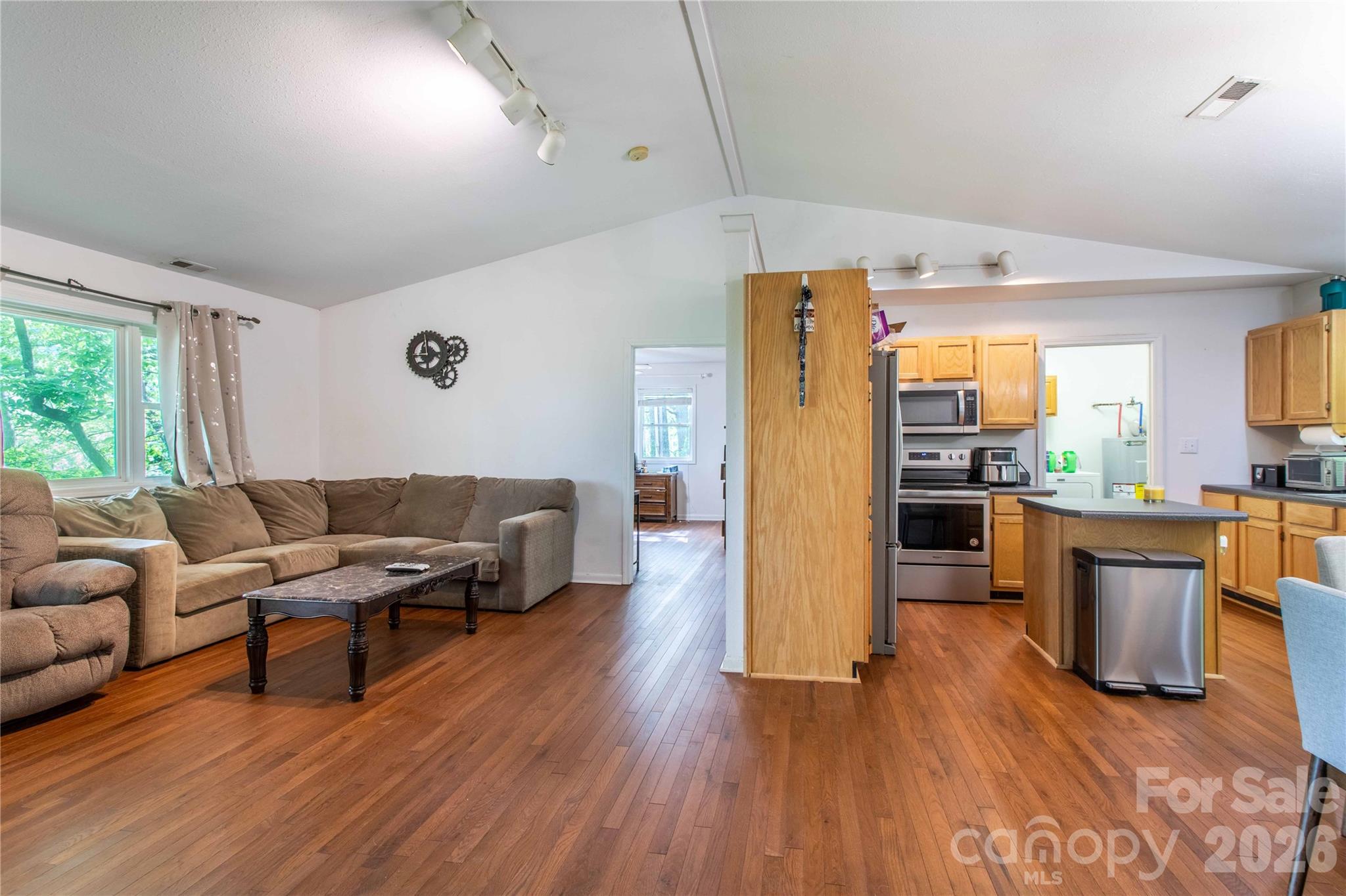 115 Knoll Ridge Waynesville, NC 28785 - Photo 11 of 35 a living room with furniture and kitchen view