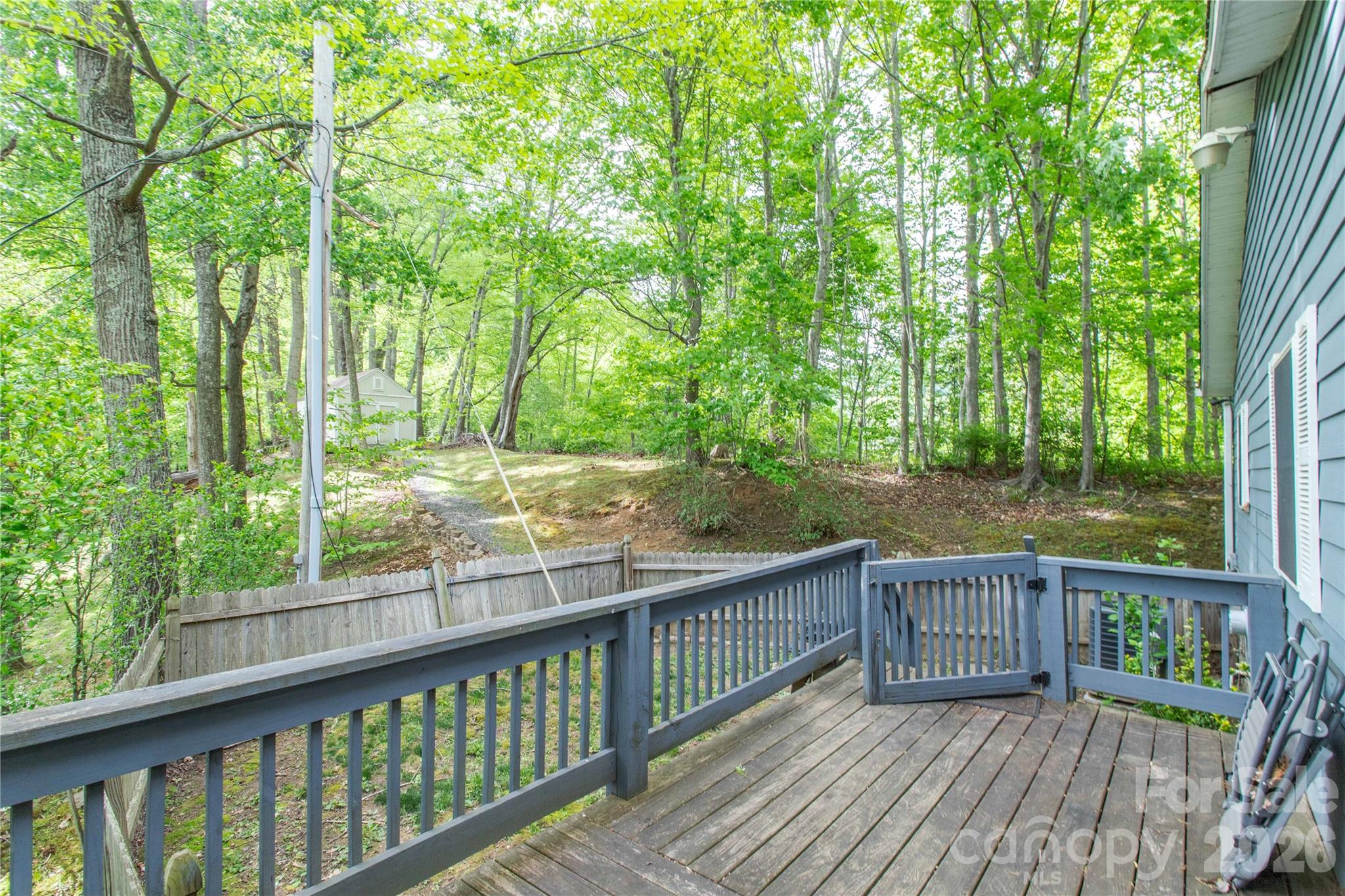 115 Knoll Ridge Waynesville, NC 28785 - Photo 6 of 35 a view of a wooden deck next to a yard