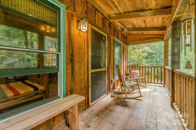 a view of two chairs in the balcony