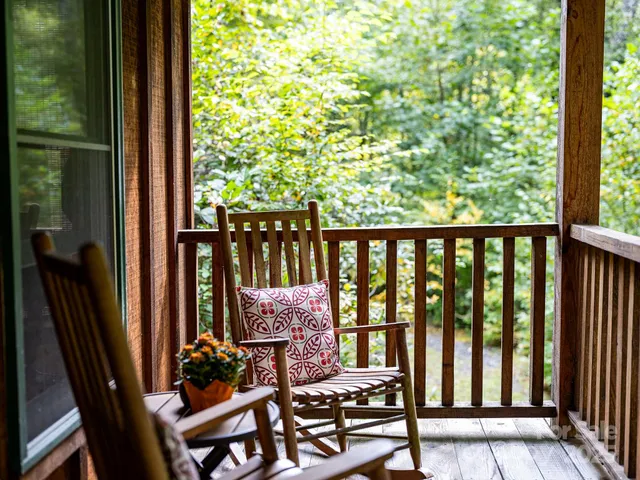 a view of a balcony with chairs