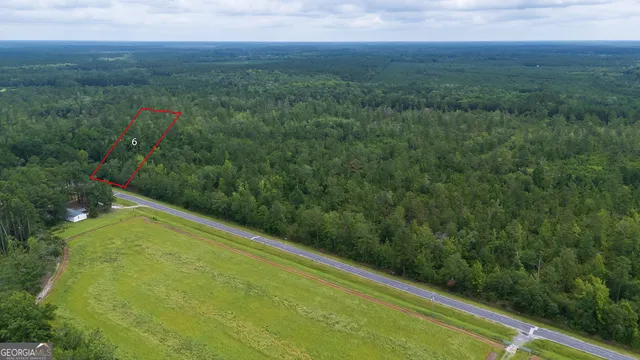 a view of a field with an outdoor space