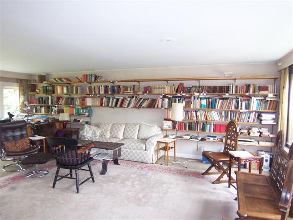 5 Hazelwood Road Worcester, MA 01609 - Photo 14 of 15 a living room with lots of furniture and a book shelf
