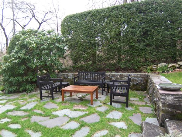 5 Hazelwood Road Worcester, MA 01609 - Photo 6 of 15 a backyard of a house with fire pit table and chairs