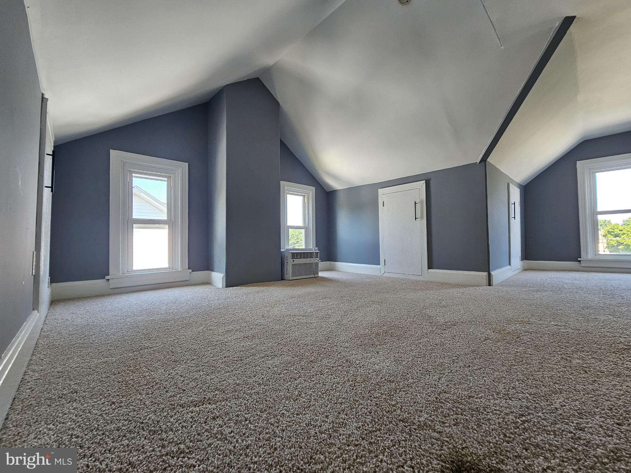 526 Ridge Street Steelton, PA 17113 - Photo 19 of 19 a view of a big room with windows and chandelier fan