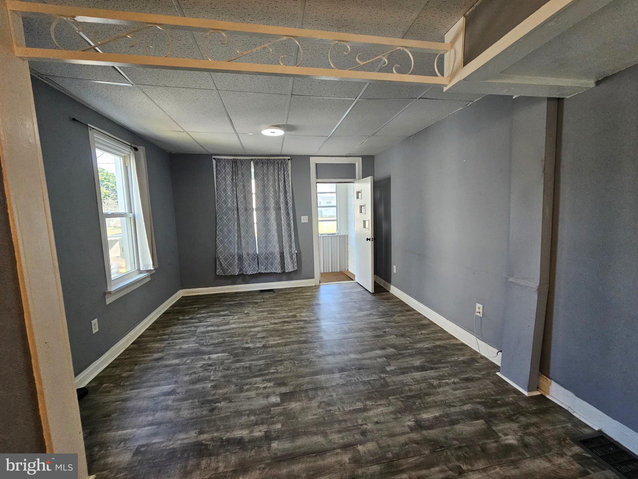 526 Ridge Street Steelton, PA 17113 - Photo 7 of 19 a view of empty room with wooden floor and fan