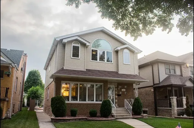 a front view of a house with a yard