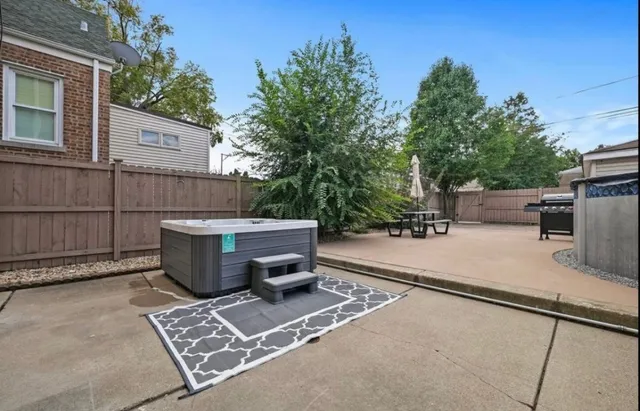 a view of a backyard with sitting area