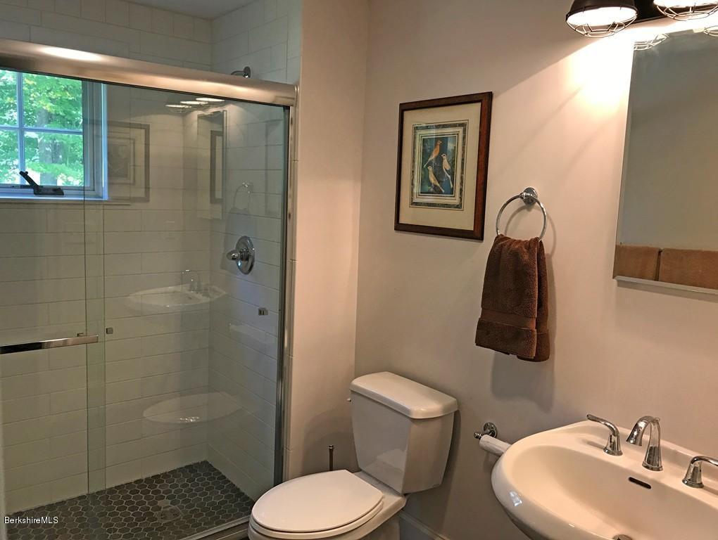 82 Christian Hill Road Colrain, MA 01340 - Photo 22 of 28 a bathroom with a toilet sink and shower
